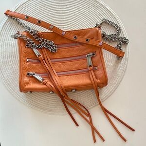 REBECCA MINKOFF Orange Leather Crossbody Bag with silver accents and studs.